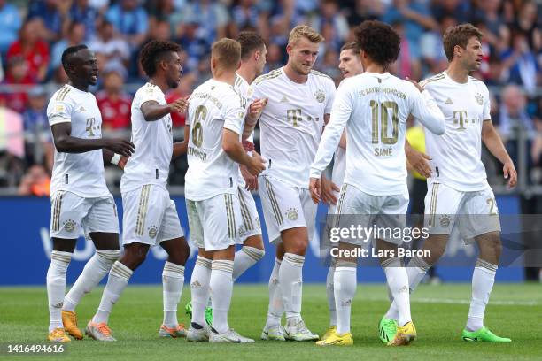 Matthijs de Ligt of Bayern Munich celebrates with teammates after scoring their team's second goal during the Bundesliga match between VfL Bochum...