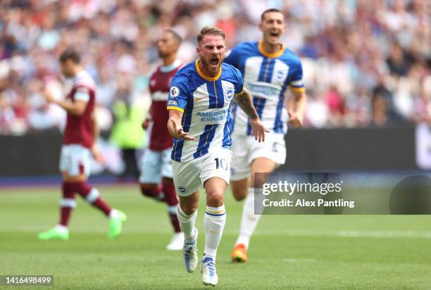 Alexis Mac Allister of Brighton & Hove Albion celebrates after scoring their team's first goal from the penalty spot during the Premier League match...