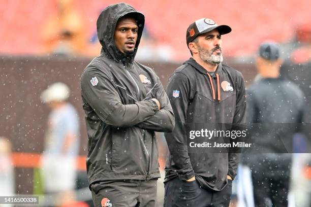 Quarterback Deshaun Watson stands on the field with head coach Kevin Stefanski of the Cleveland Browns prior to the start of a preseason game against...