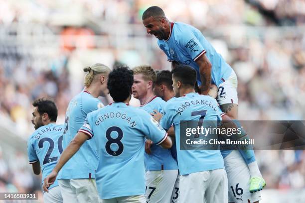 Erling Haaland of Manchester City celebrates with teammates after scoring their team's second goal during the Premier League match between Newcastle...