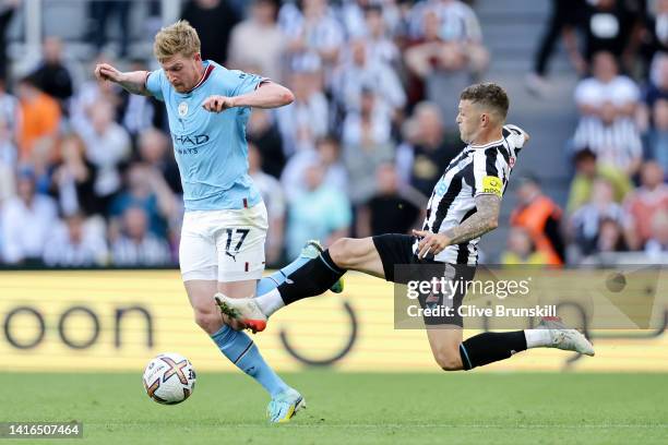 Kevin De Bruyne of Manchester City is fouled by Kieran Trippier of Newcastle United, leading to a red card which is later overturned by VAR during...