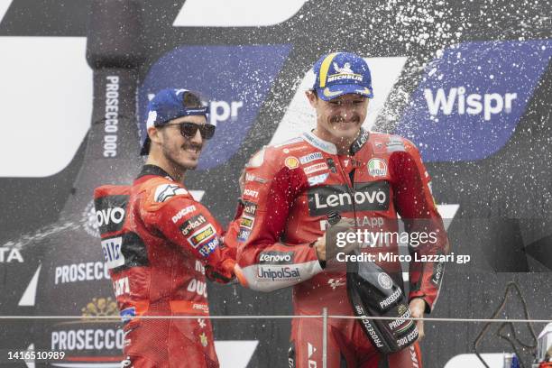 Francesco Bagnaia of Italy and Ducati Lenovo Team and Jack Miller of Australia and Ducati Lenovo Team celebrate on the podium during the MotoGP race...