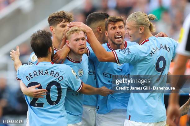 Bernardo Silva of Manchester City celebrates with teammates Kevin De Bruyne, Ruben Dias and Erling Haaland after scoring his side's third goal during...