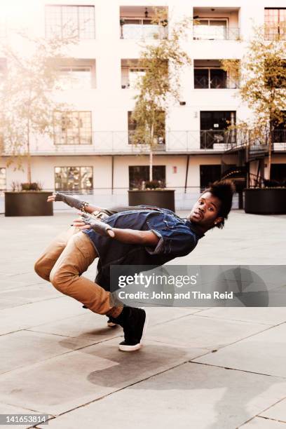 break dancer at courtyard - bending over backwards stock pictures, royalty-free photos & images