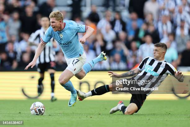 Kevin De Bruyne of Manchester City is fouled by Kieran Trippier of Newcastle United, leading to a red card which is later overturned by VAR during...