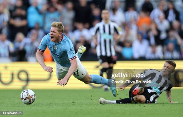 Kevin De Bruyne of Manchester City is fouled by Kieran Trippier of Newcastle United, leading to a red card which is later overturned by VAR during...