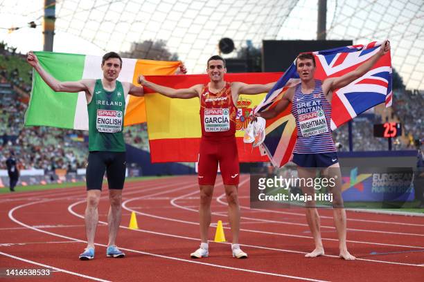 Bronze medalist Mark English of Ireland, Gold medalist Mariano Garcia of Spain and silver medalist Jake Wightman of Great Britain celebrate following...