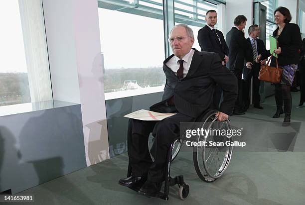 German Finance Minister Wolfgang Schaeuble arrives at the German government cabinet meeting on March 21, 2012 in Berlin, Germany. High on the...