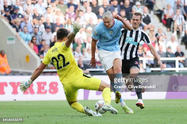 Erling Haaland of Manchester City has a shot saved by Nick Pope of Newcastle United during the Premier League match between Newcastle United and...