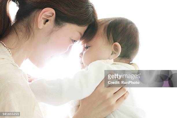 mother&baby - mother holding baby white background stock pictures, royalty-free photos & images