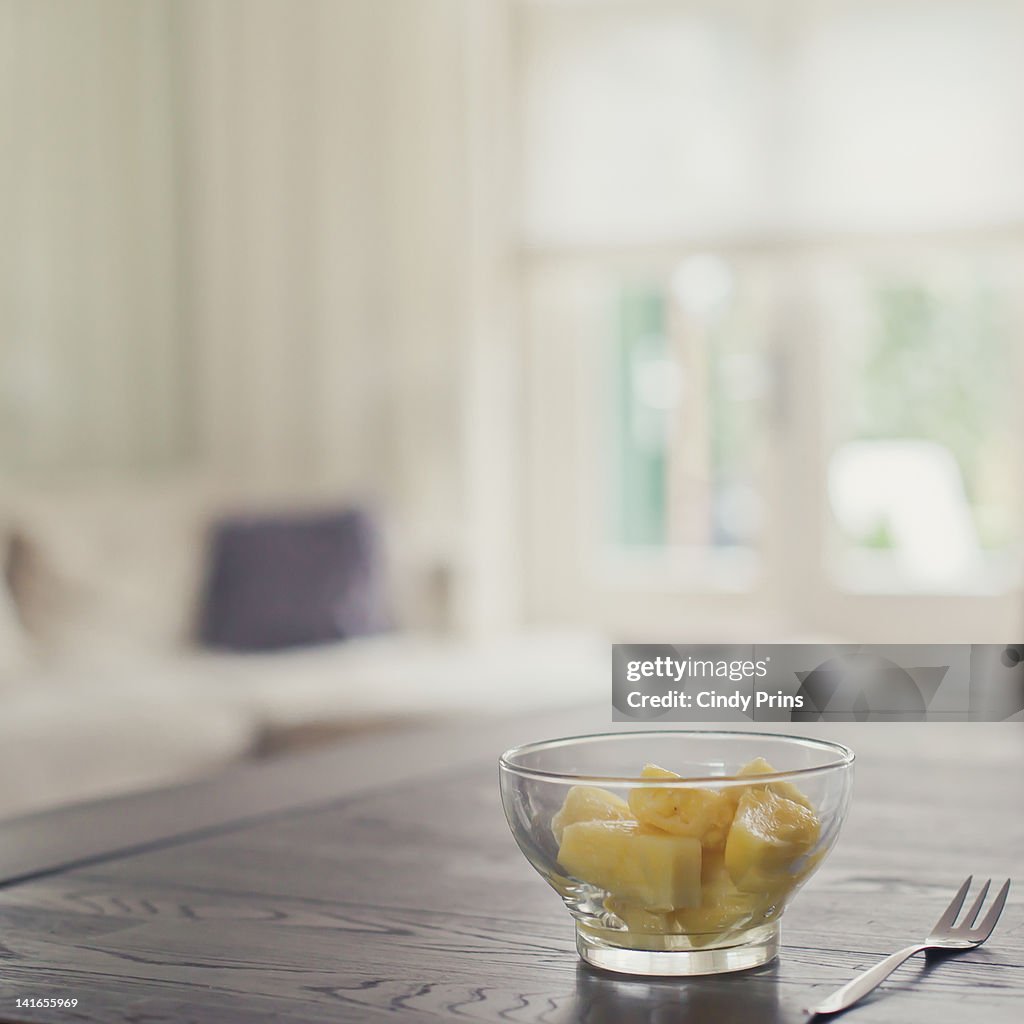 Glass bowl of pineapple chunks