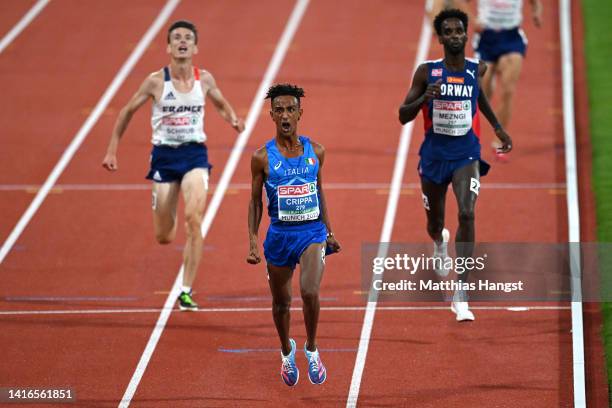 Yemaneberhan Crippa of Italy crosses the finish line and reacts after winning gold in the Athletics - Men's 10,000m Final on day 11 of the European...