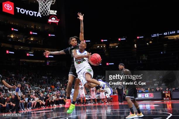 Gillie attempts to shoot against NLE Choppa during the celebrity game prior to the BIG3 Championship at State Farm Arena on August 21, 2022 in...