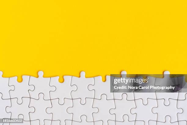 jigsaw puzzle on yellow background - connect the dots puzzle stock pictures, royalty-free photos & images