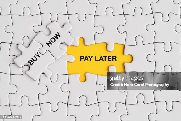 buy now pay later text on jigsaw puzzle - deadline stock pictures, royalty-free photos & images