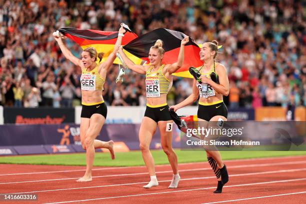 Gold medalists Gina Luckenkemper, Lisa Mayer and Rebekka Haase of Germany celebrate after the Athletics - Women's 4x100m Relay Final on day 11 of the...