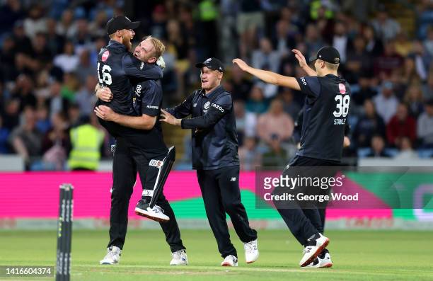 Paul Walter of Manchester Originals celebrates with teammates after the wicket of Harry Brooke of Northern Superchargers during the Hundred match...