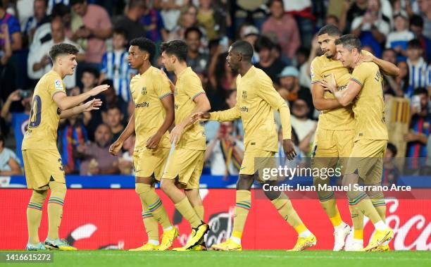 Robert Lewandowski of FC Barcelona celebrates after scoring their side's first goal during the LaLiga Santander match between Real Sociedad and FC...