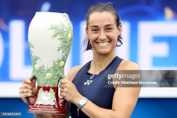 Caroline Garcia of France holds the winner's trophy after defeating Petra Kvitova of Czech Republic during the women's final of the Western &...