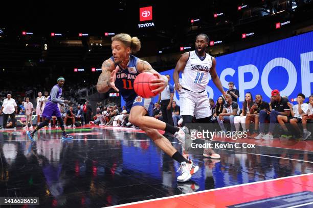 Michael Beasley of 3's Company drives against Jeremy Pargo of the Triplets during the All-Star game prior to the BIG3 Championship at State Farm...