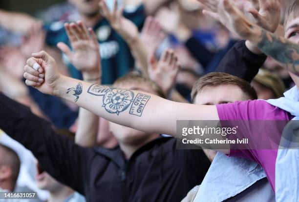 Fan with a Leeds United tattoo on his arm during the Premier League match between Leeds United and Chelsea FC at Elland Road on August 21, 2022 in...