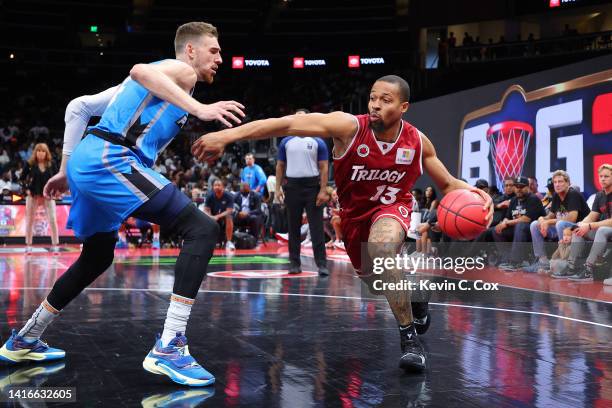 Isaiah Briscoe of the Trilogy drives against TJ Cline of the Power during the BIG3 Championship at State Farm Arena on August 21, 2022 in Atlanta,...