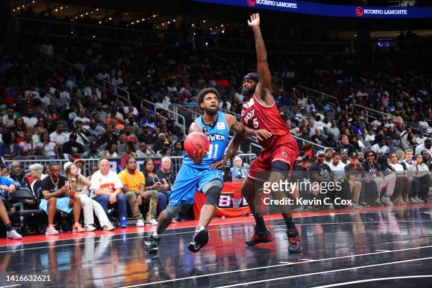 Glen Rice Jr. #41 of the Power drives against Earl Clark of the Trilogy during the BIG3 Championship at State Farm Arena on August 21, 2022 in...