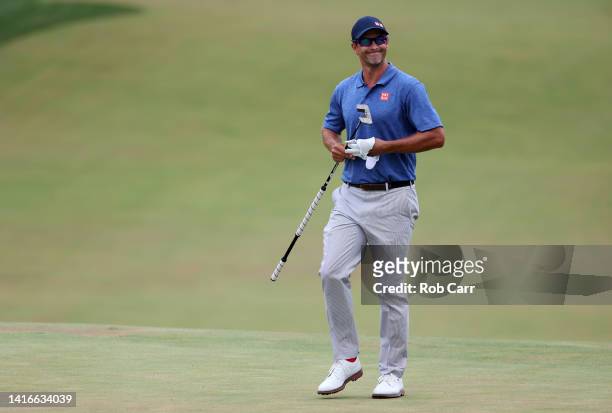 Adam Scott of Australia smiles after chipping out of the bunker on the 18th green during the final round of the BMW Championship at Wilmington...