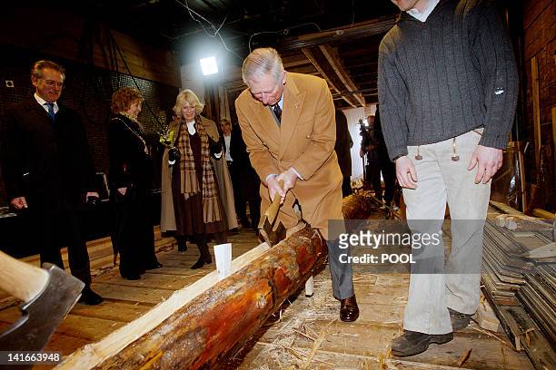 Duchess of Cornwall, Camilla , Norway's Queen Sonja and King Harald look at Britain's Prince Charles as he uses an axe during a visit of the...