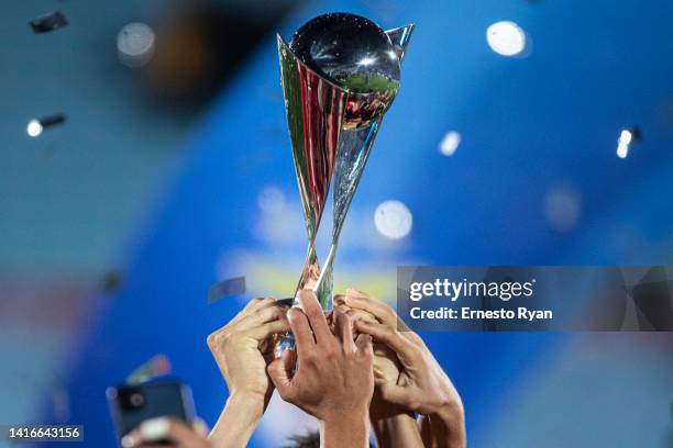 Players of Benfica celebrate with the champion trophy after winning a match between Peñarol and Benfica as part of U20 InterContinental Cup 2022 at...