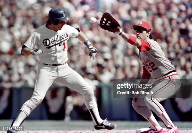 Los Angeles Dodgers Catcher Mike Scioscia scrambles - then gets tagged out going back to 1st base by St. Louis Cardinals 1st baseman Jack Clark...