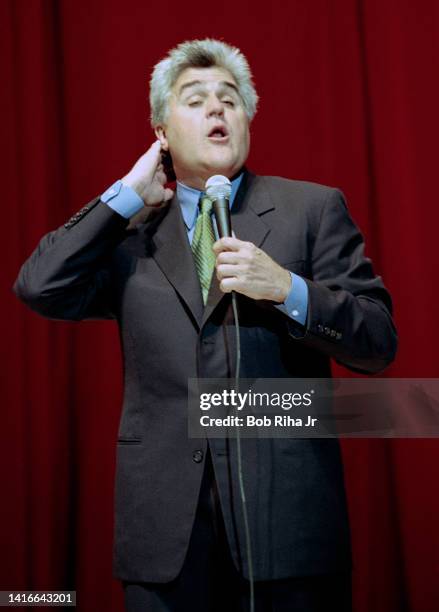 Comedian Jay Leno performs on stage at the Shrine Auditorium, October 26, 1999 in Los Angeles, California.