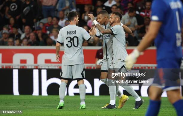 Kylian Mbappe of Paris Saint-Germain celebrate his third goals with Lionel Messi and Neymar Jr during the Ligue 1 match between Lille OSC and Paris...