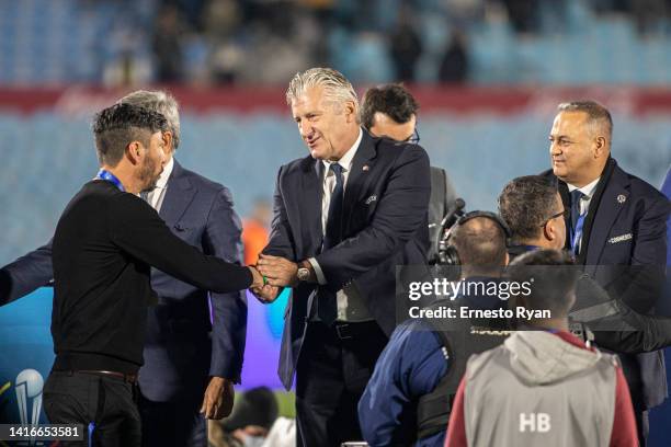 President of the Croatian Football Association Davor Suker gives a medal to Juan Manuel Olivera coach of Peñarol after a match between Peñarol and...