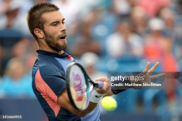Borna Coric of Croatia returns a shot against Stefanos Tsitsipas of Greece during their Men's Singles Final match on day nine of the Western &...