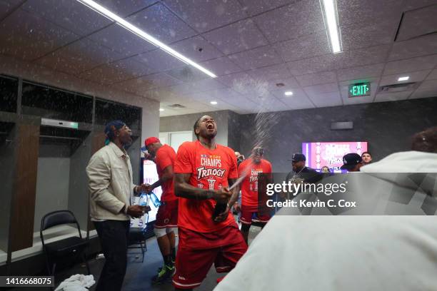 Amir Johnson of the Trilogy celebrates with champagne in the locker room after defeating Power during the BIG3 Championship at State Farm Arena on...