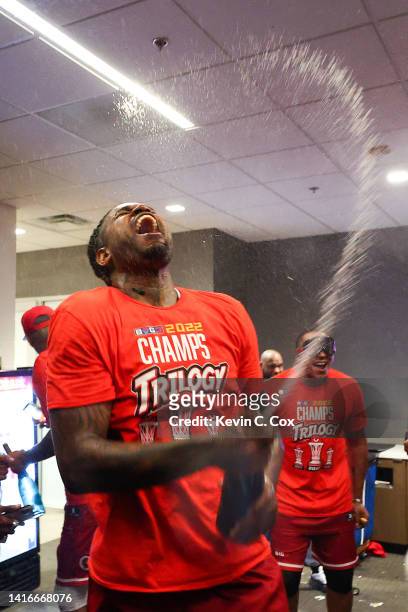 Amir Johnson of the Trilogy celebrates with champagne in the locker room after defeating Power during the BIG3 Championship at State Farm Arena on...