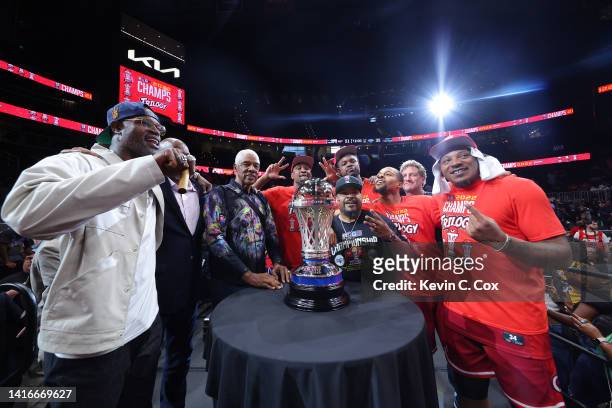 Head coach Stephen Jackson of the Trilogy, Clyde Drexler, Julius Erving, Ice Cube and the Trilogy team pose for a photo with the trophy after Trilogy...