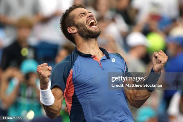 Borna Coric of Croatia celebrates after defeating Stefanos Tsitsipas of Greece in their Men's Singles Final match on day nine of the Western &...