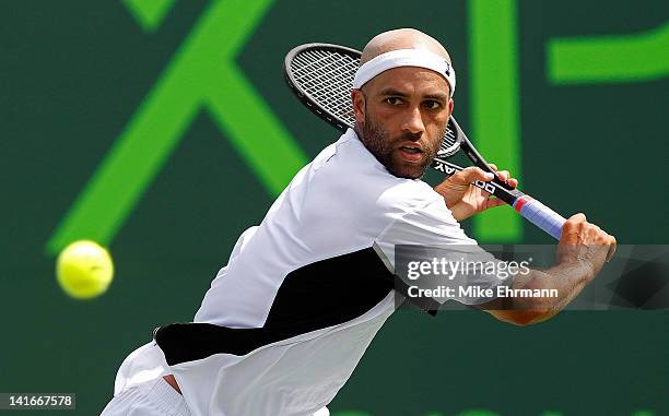 James Blake in action against Nikolay Davydenko of Russia during Day 3 of the Sony Ericsson Open at Crandon Park Tennis Center on March 21, 2012 in...