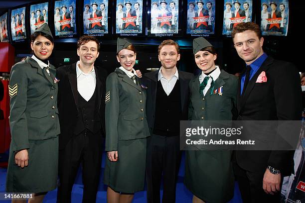 Actors Christian Friedel, Matthias Schweighoefer and Friedrich Muecke stand between hostesses dressed like Russian at the 'Russendisko' World...