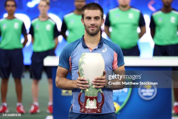 Borna Coric of Croatia celebrates after defeating Stefanos Tsitsipas of Greece in their Men's Singles Final match on day nine of the Western &...