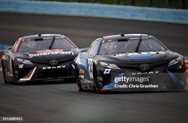 Bubba Wallace, driver of the SiriusXM Radio Toyota, and Ty Gibbs, driver of the Toyota SmartPath Toyota, race during the NASCAR Cup Series Go Bowling...