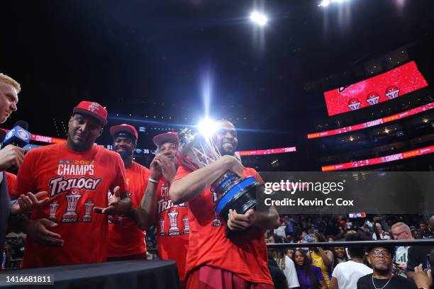 Isaiah Briscoe of the Trilogy celebrates with the trophy after defeating Power during the BIG3 Championship at State Farm Arena on August 21, 2022 in...