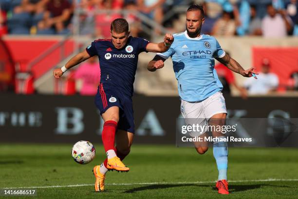 Chris Mueller of Chicago Fire takes a shot on goal against Maxime Chanot of New York City FC during the first half at SeatGeek Stadium on August 21,...