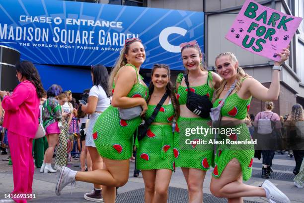 Fans wearing matching watermelon outfits representing the song "Watermelon Sugar" pose for a photo before the Harry Styles Love On Tour 2022 concert...