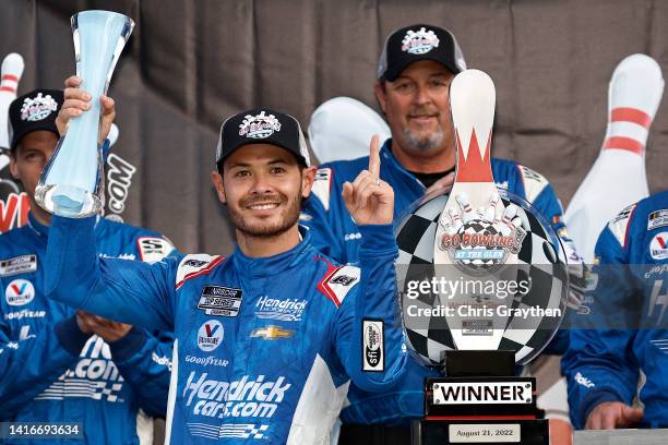 Kyle Larson, driver of the HendrickCars.com Chevrolet, celebrates in victory lane after winning the NASCAR Cup Series Go Bowling at The Glen at...