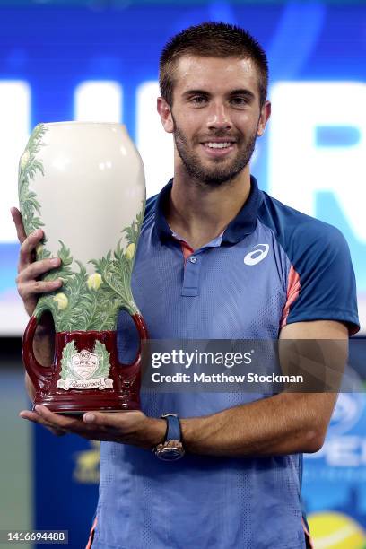 Borna Cric of Croatia poses for photographers after defeating Stefanos Tsitsipas of Greece during the men's final of the Western & Southern Open at...