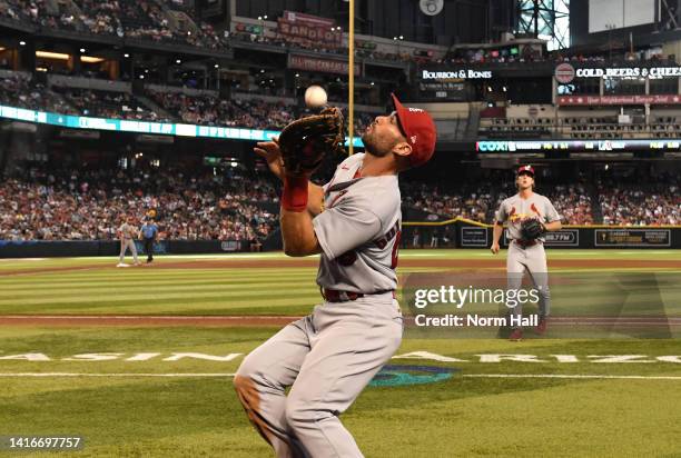 Paul Goldschmidt of the St Louis Cardinals catches a pop foul ball hit by Carson Kelly of the Arizona Diamondbacks during the sixth inning at Chase...