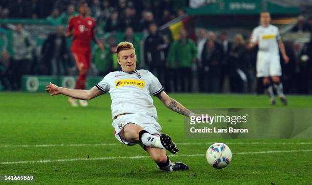 Marco Reus of Moenchengladbach shoots on goal during the DFB Cup semi final match between Borussia Moenchengladbach and FC Bayern Muenchen at...